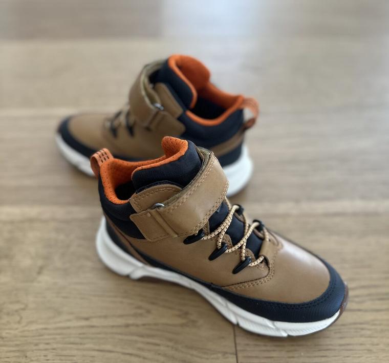 A pair of children's supportive high-top shoes